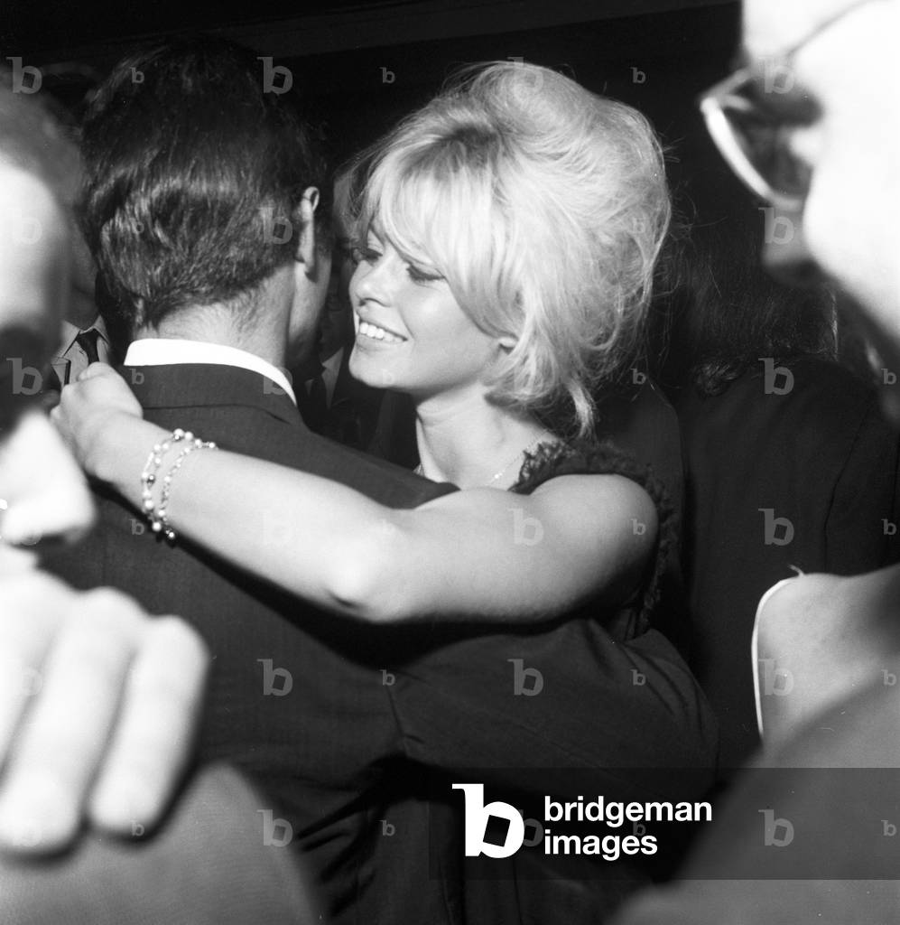 Brigitte Bardot at a party, Italy, 1962 (b/w photo)