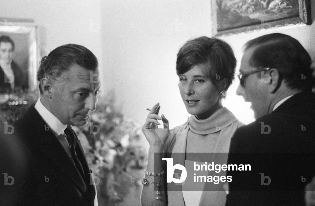 Gianni Agnelli attending a party at Pierre Cardin's fashion house, France, Paris, 1964 (b/w photo)