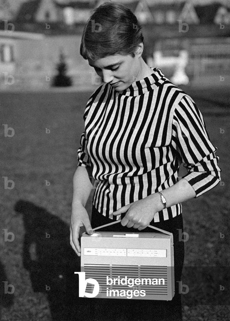 Girl with portable radio, Italy