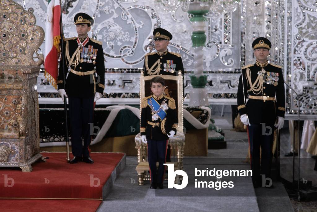 Reza Cyrus Pahlavi in uniform sitting on a thrown, Teheran, Iran