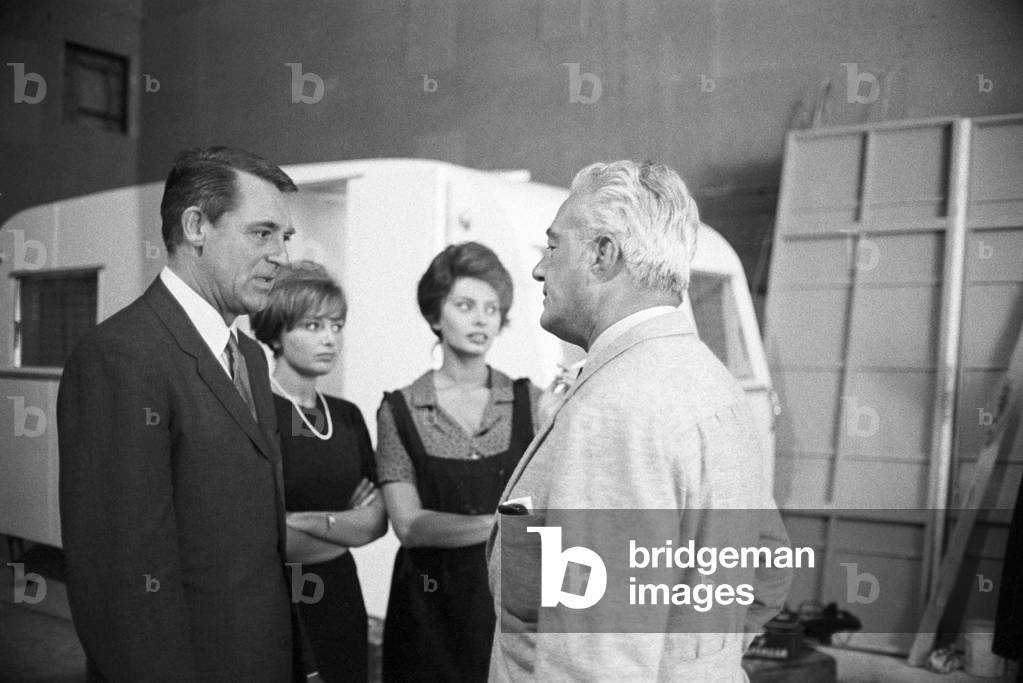 The international stars Sophia Loren and Cary Grant on the set of the film 'Two Women' with the director Vittorio De Sica, Italy, 1950 (b/w photo)