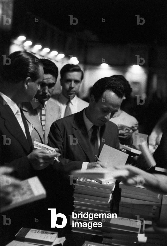 Giorgio Bassani signing his book