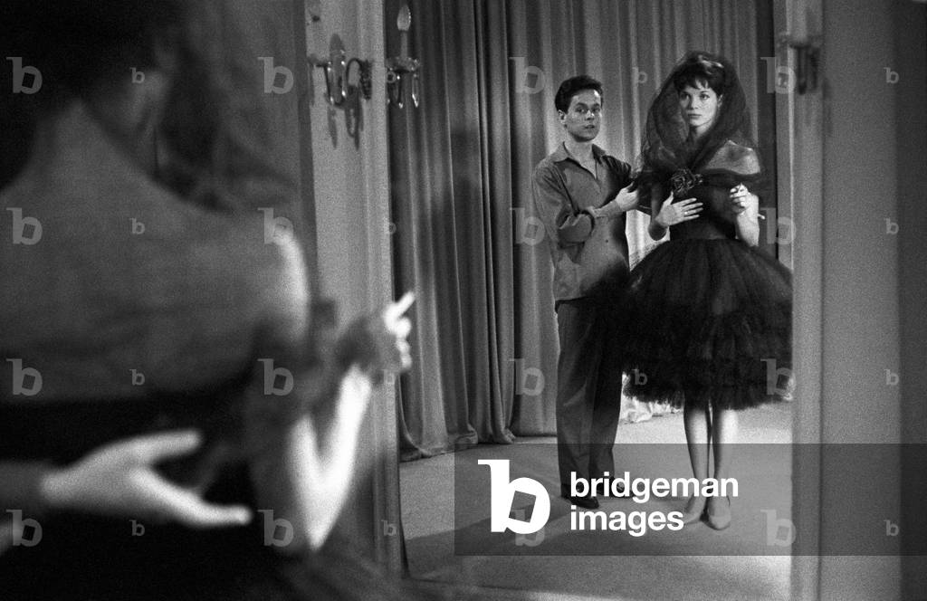 Roberto Capucci watching a model wearing a tulle dress