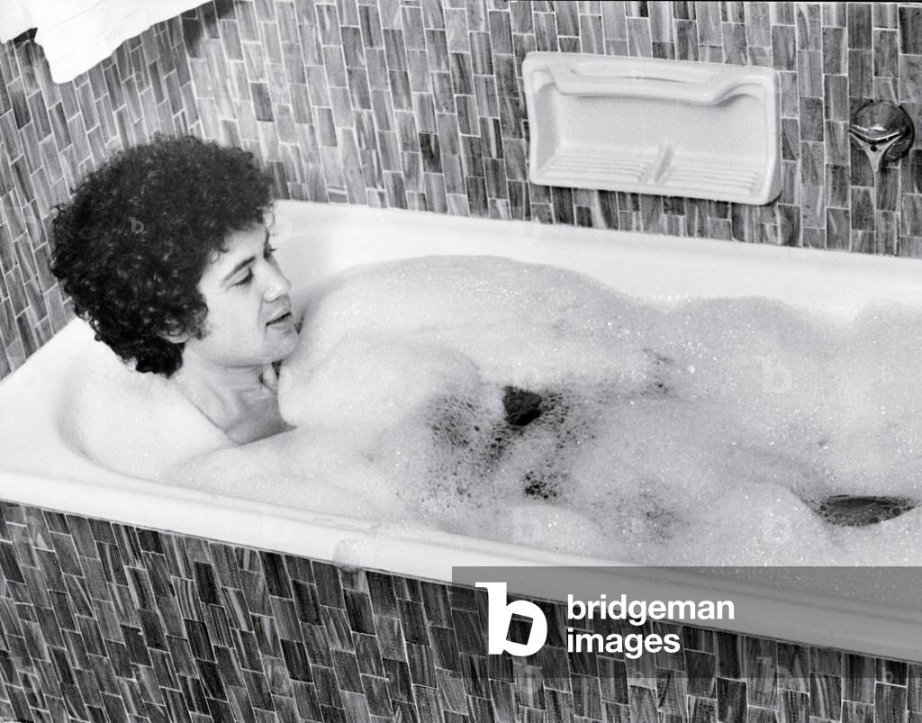 Lucio Battisti relaxing in the tub, Milan, Italy