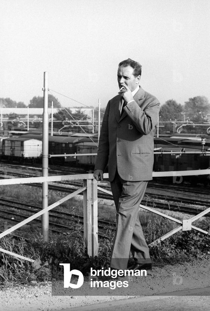 Vittorio Sereni smoking a cigarette, Milan, Italy, 1967