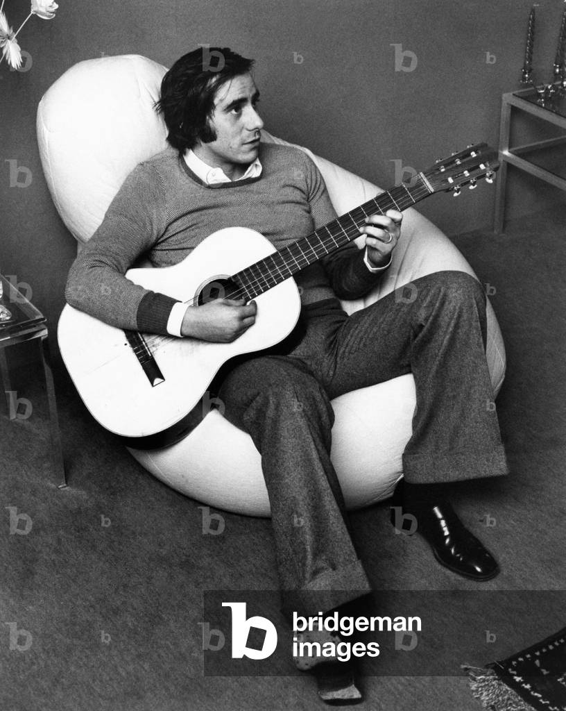 Roberto Vecchioni playing the guitar, Milan, Italy, 1970