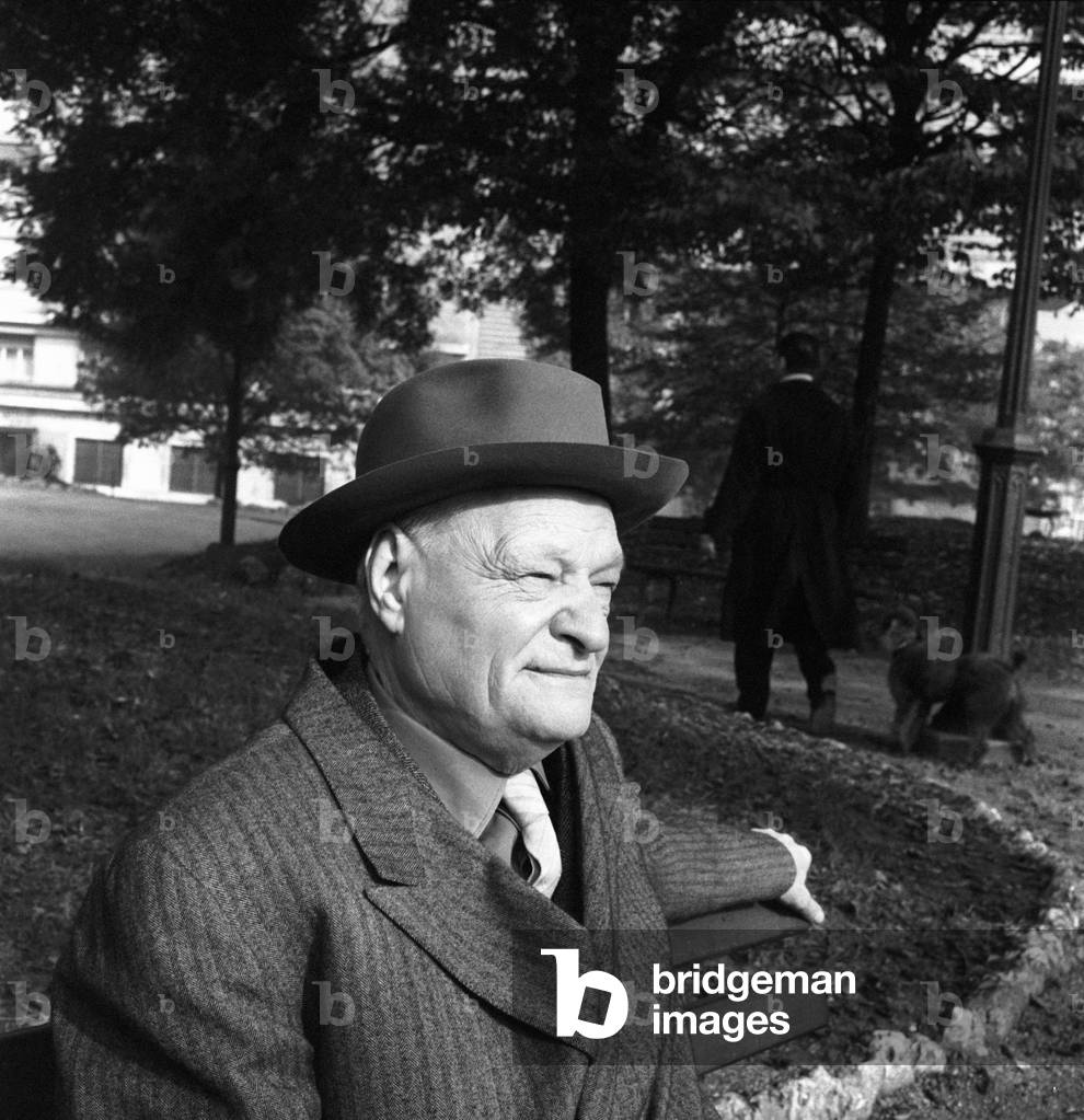 Giuseppe Ungaretti seated on the bench in a park