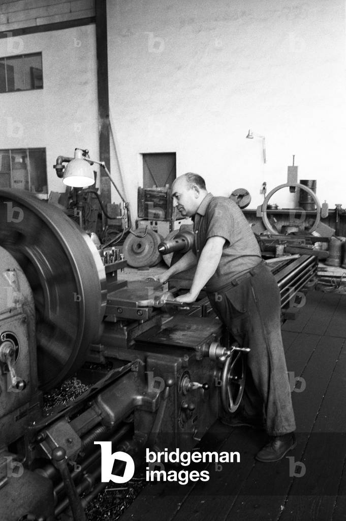 Worker in a factory, Switzerland, 1960