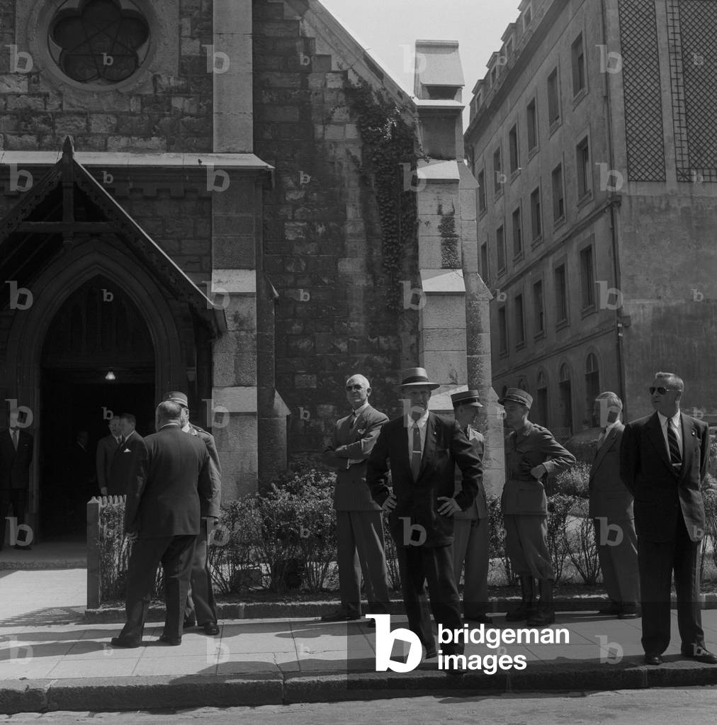 People guarding the entrance of the Emmanuel Church in Geneva, Geneva, Switzerland