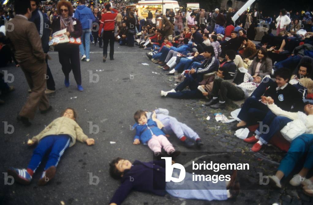 Children lying on the ground at a peace demonstration