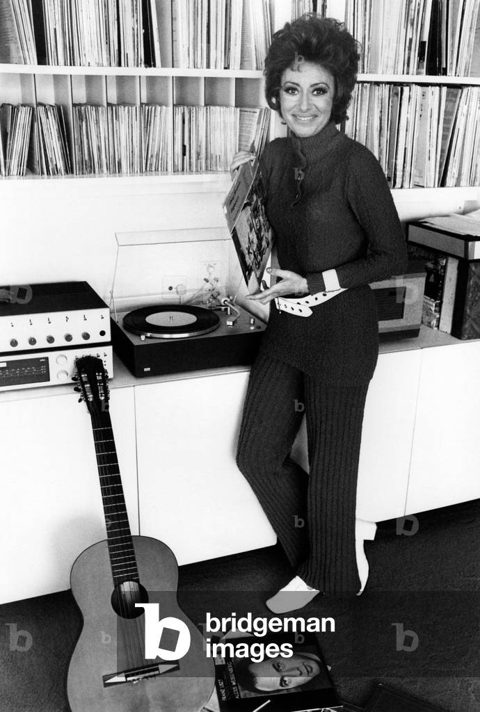 Caterina Valente near a record player