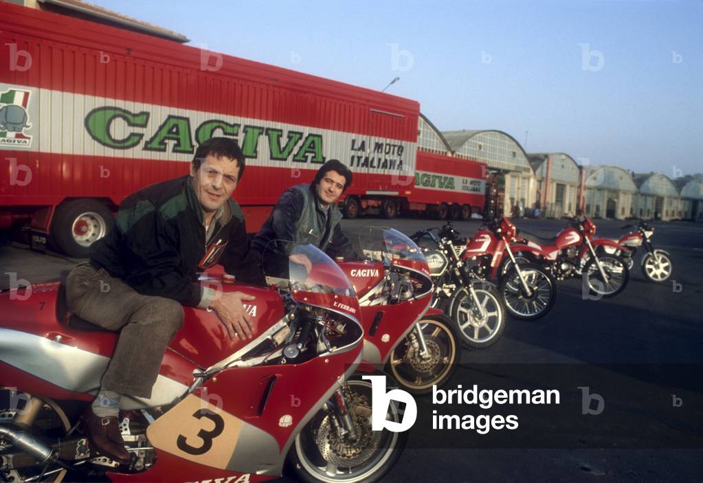 Claudio Castiglioni and Gianfranco Castiglioni posing on two Cagiva motorcycles