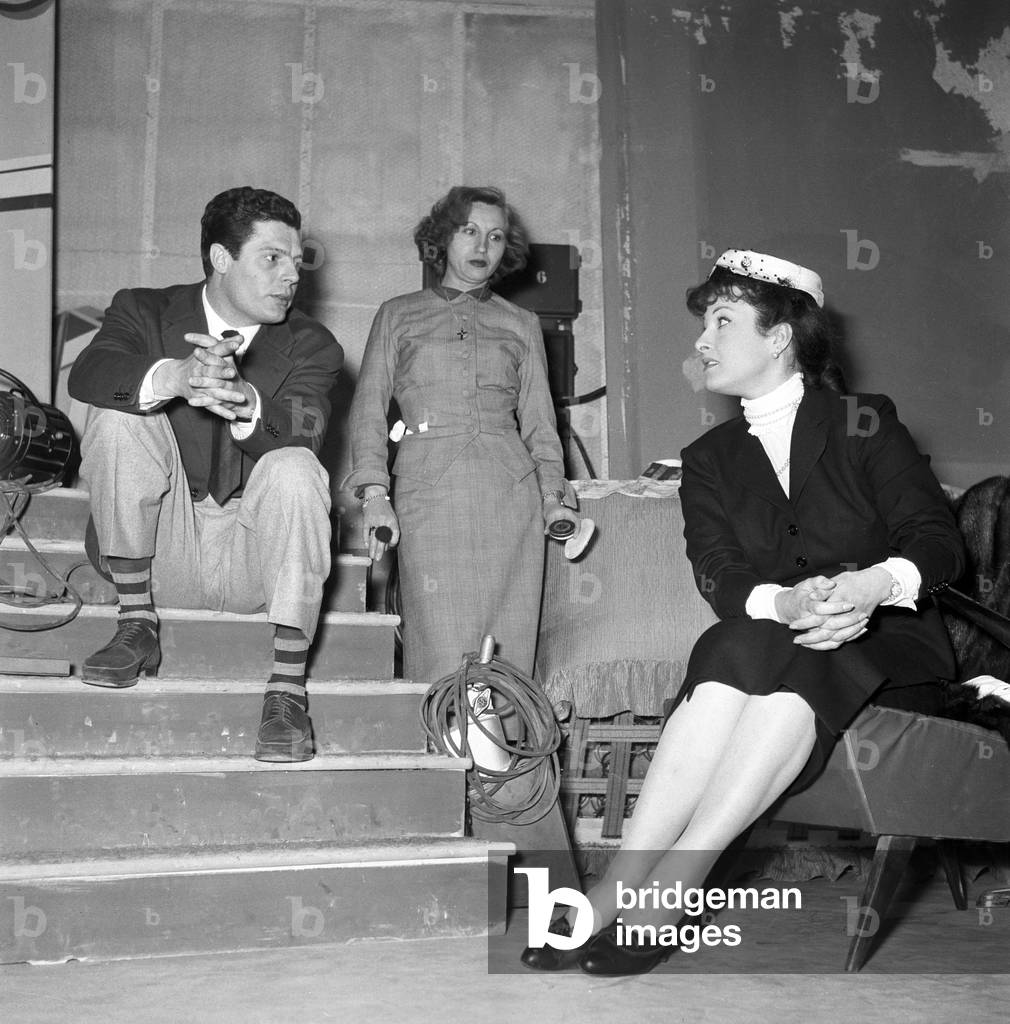 Marcello Mastroianni and Silvana Pampanini being interviewed on TV, Italy, 1956 (b/w photo)