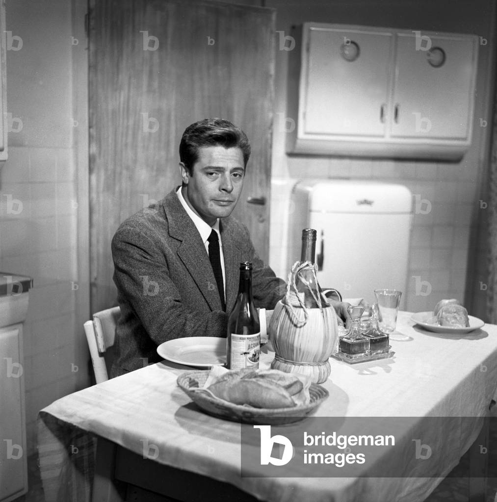 Marcello Mastroianni having dinner in Everyone's in Love, Italy, 1958 (b/w photo)