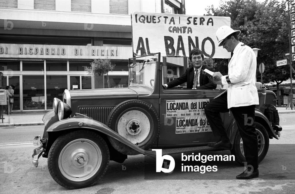 Al Bano with a traffic policeman