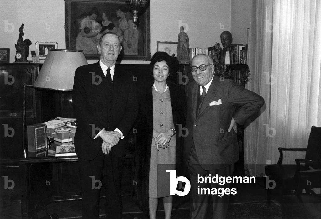Arnoldo Mondadori smiling beside Erskine Caldwell and Margaret Bourke White at his studio in Milan,  Milan, Italy