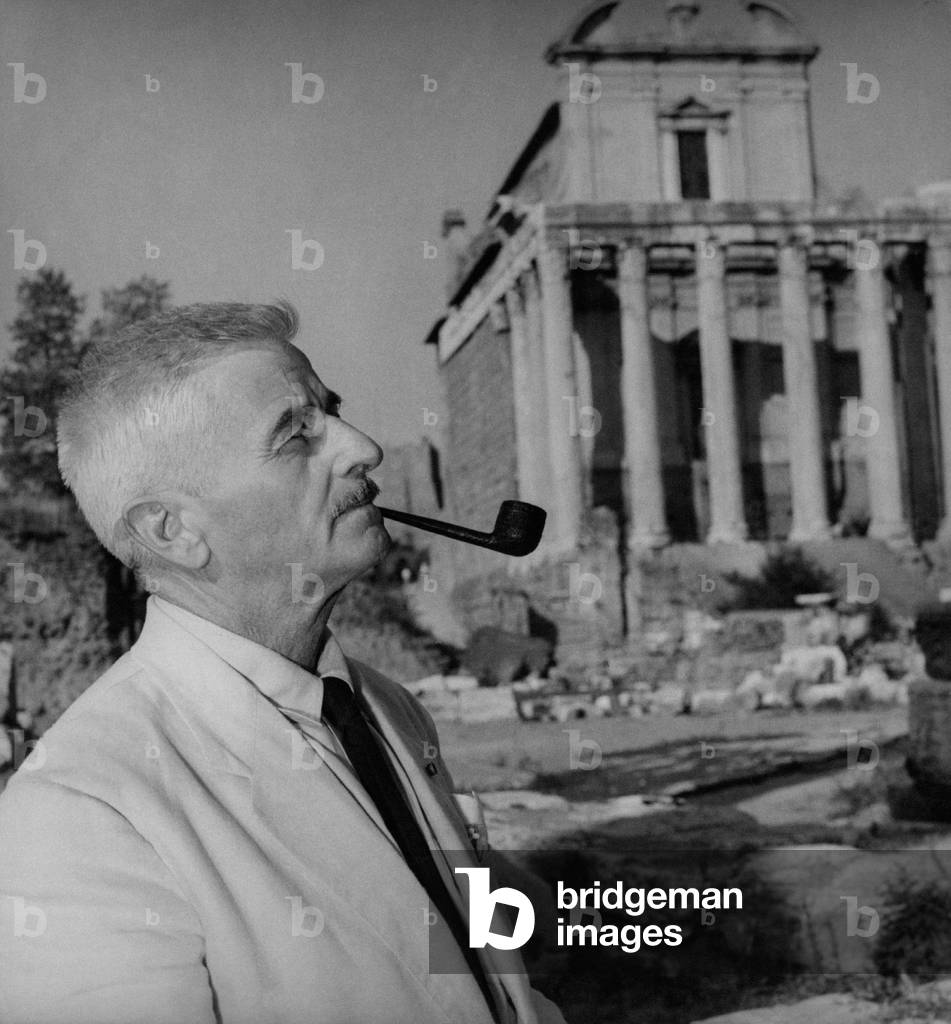 William Faulkner smoking a pipe in Rome