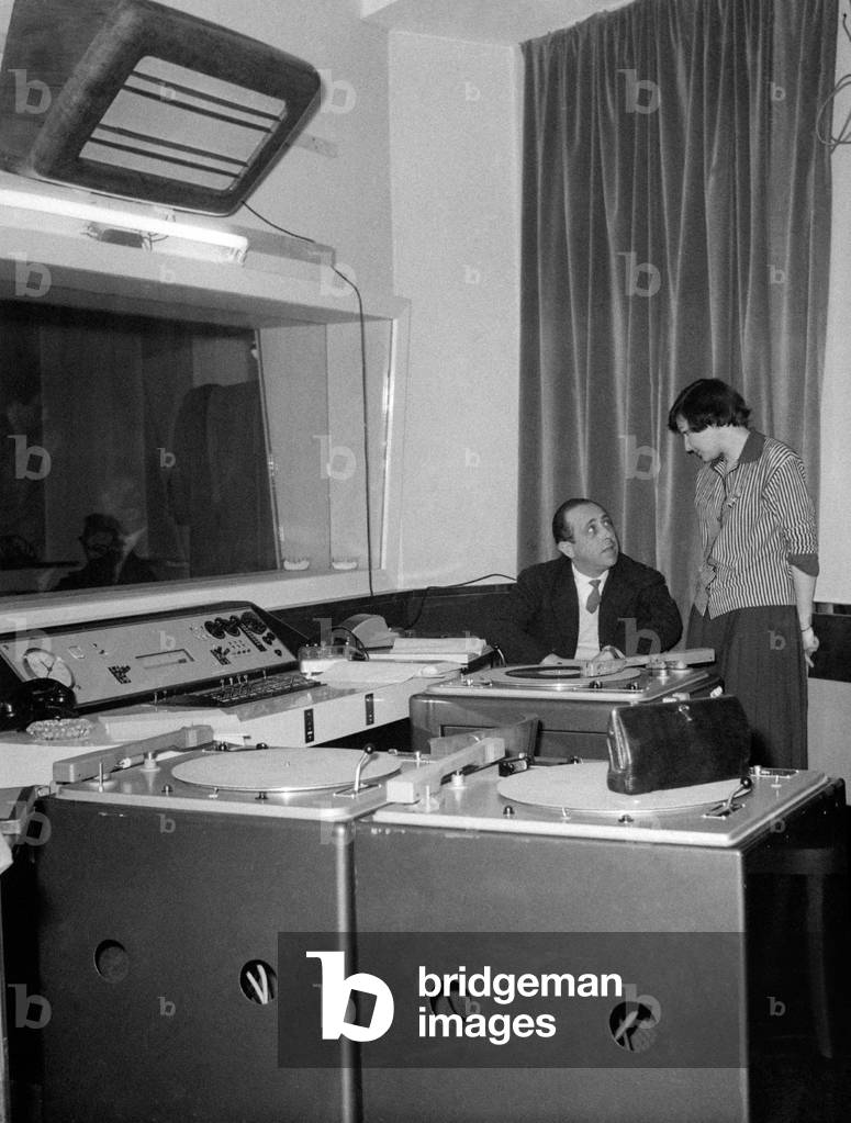 Tatiana Farnese in the recording studio of Radio Roma with the director Riccardo Mantoni, Rome, Italy, 1959