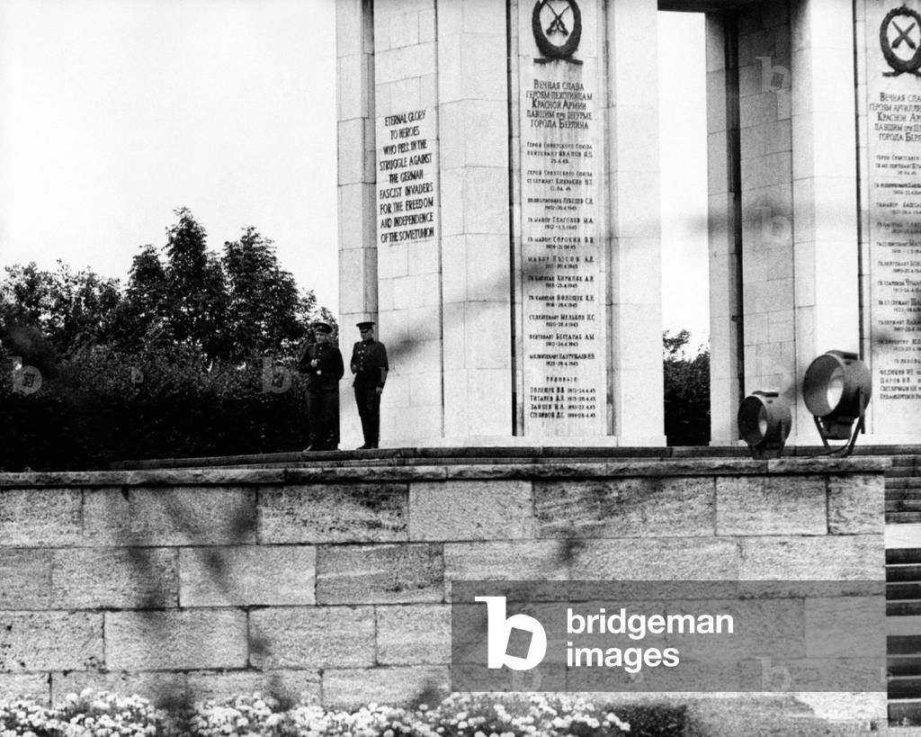 Two soldiers watching the Soviet War Memorial of Tiergarten