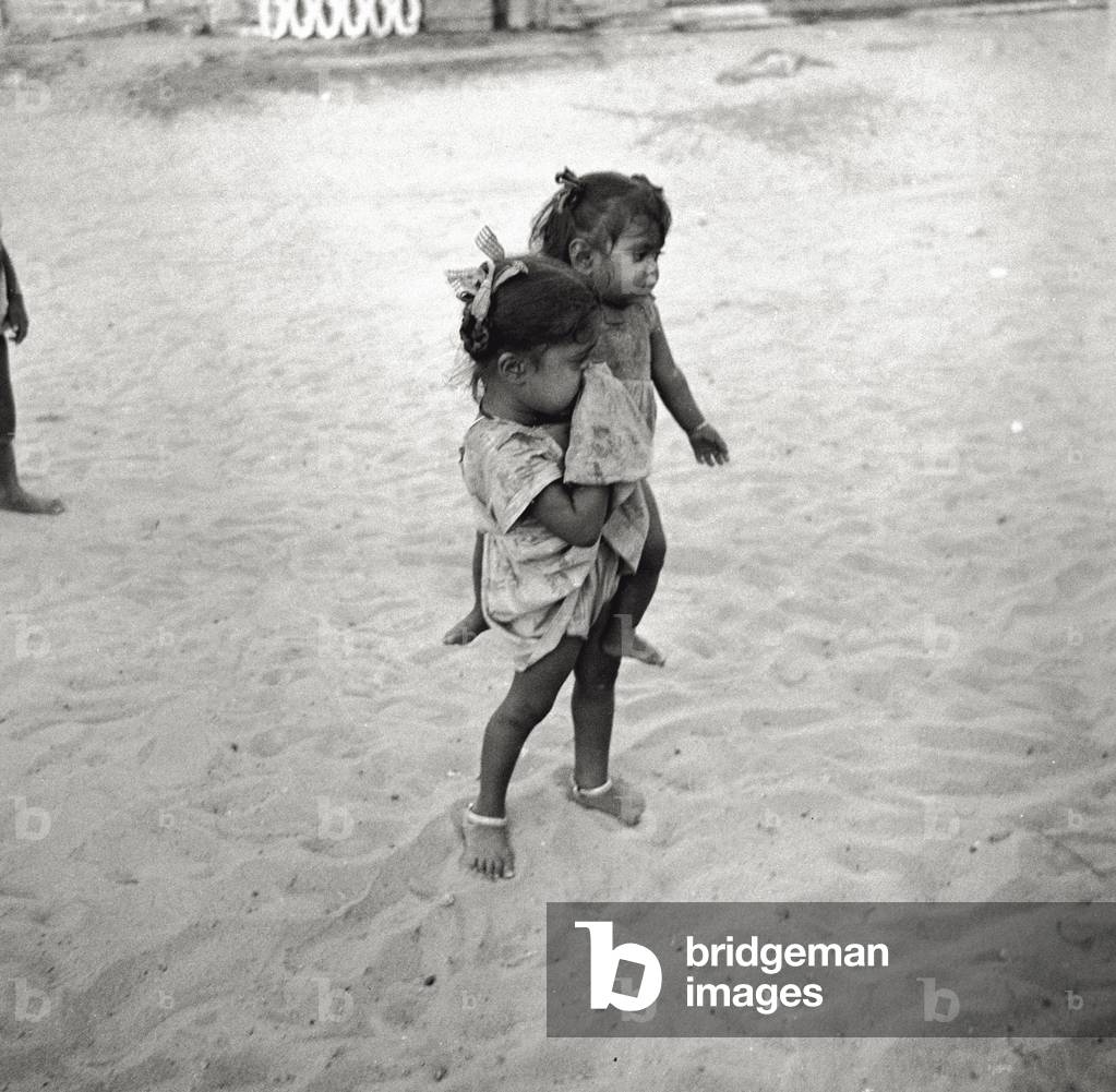 Two young sisters in the very poor outskirts of Madras, 1966 (b/w photo)