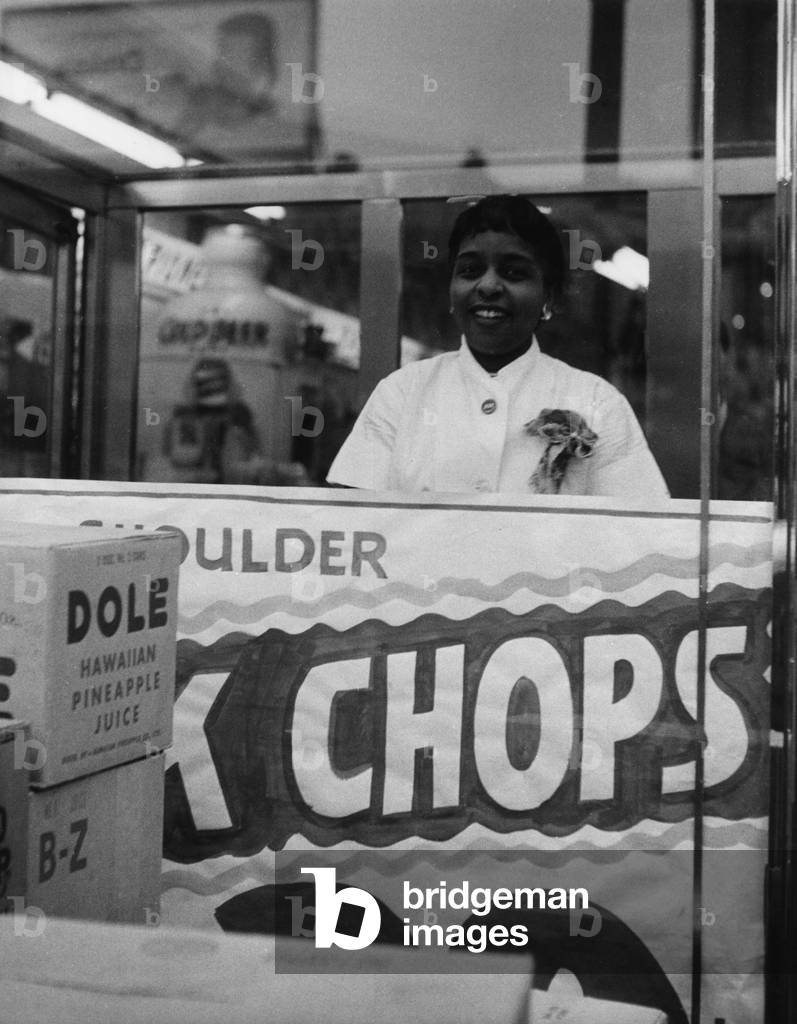 An assistant in a Harlem shop