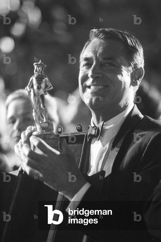 Cary Grant receiving a David di Donatello, Italy, 1960 (b/w photo)