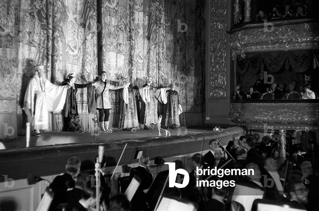 Some actors of the Teatro alla Scala company are thanking the audience at the end of the performance, 1964 (b/w photo)