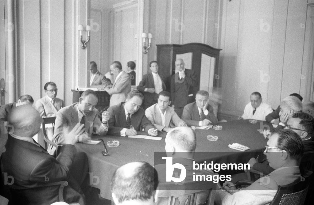 Men sitting around a table during the Geneva Summit, Geneva, Switzerland