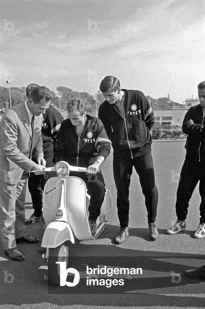 Players of Inter admiring a Vespa, Como, Italy, 1963 (b/w photo)