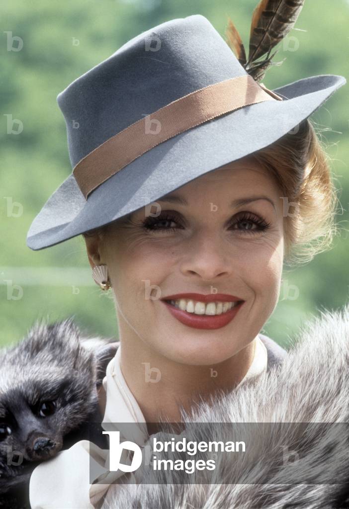 Close-up of Senta Berger with a hat