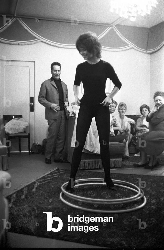 Brigitte Bardot with a hula hoop, France, 1959 (b/w photo)