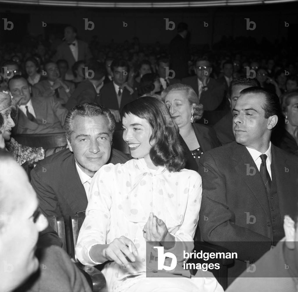 Rossano Brazzi, Elsa Martinelli and Piero Piccioni waiting for Ella Fitzgerald's concert, Italy, 1957 (b/w photo)
