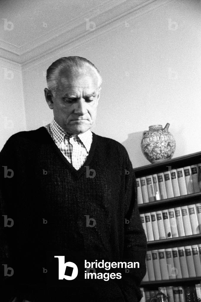 Alberto Moravia looking down