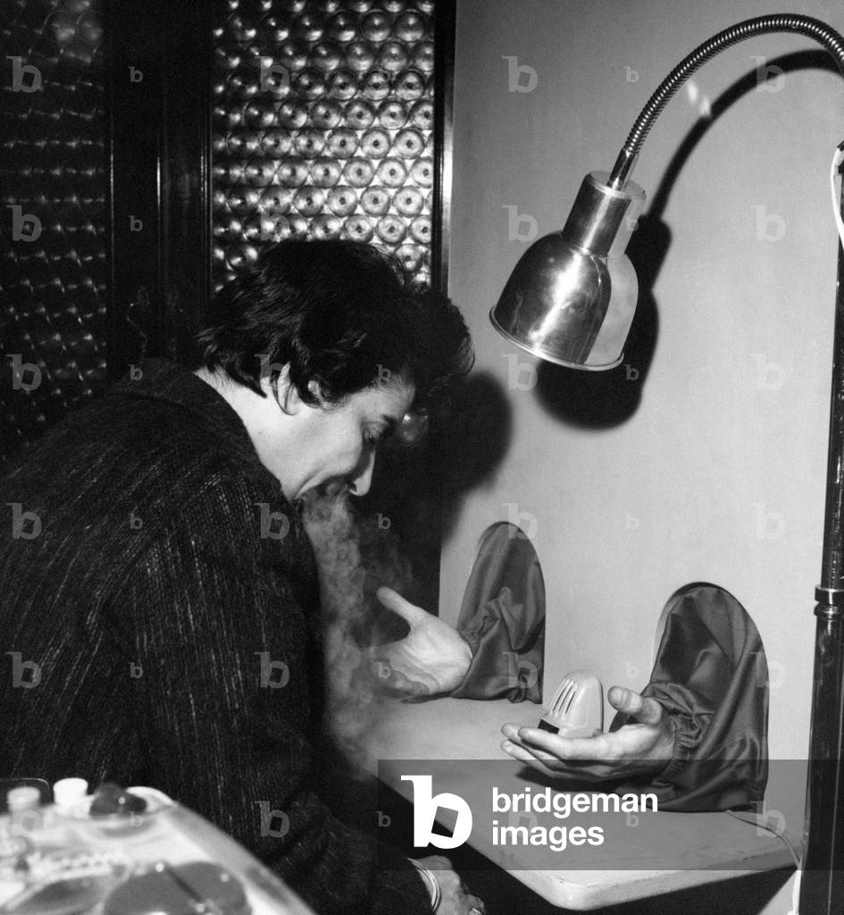 Woman sitting in front of a parapsychologist, Bologna, Italy
