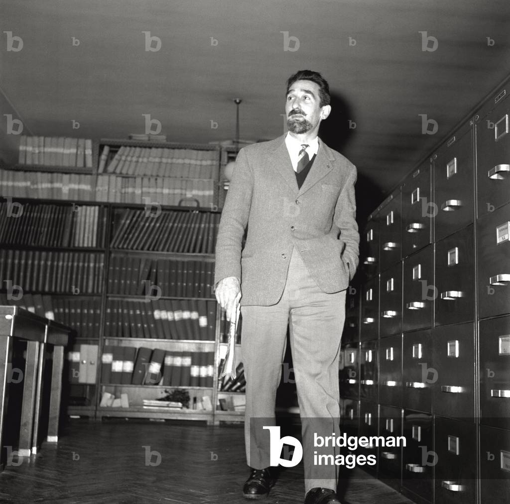 Mario Rigoni Stern in a room of the Mondadori archive, 1958 (b/w photo)