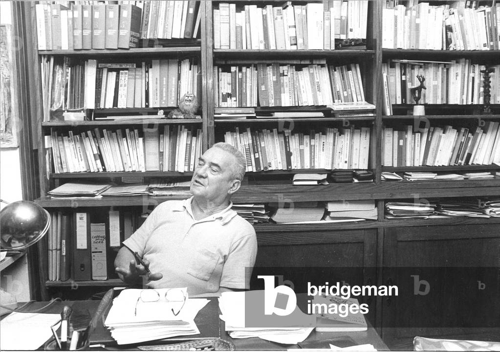 Davide Lajolo sitting at the desk