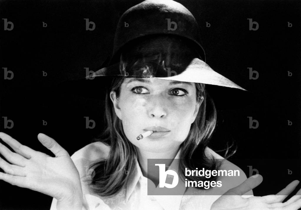 Monica Vitti smoking, 1964 (b/w photo)