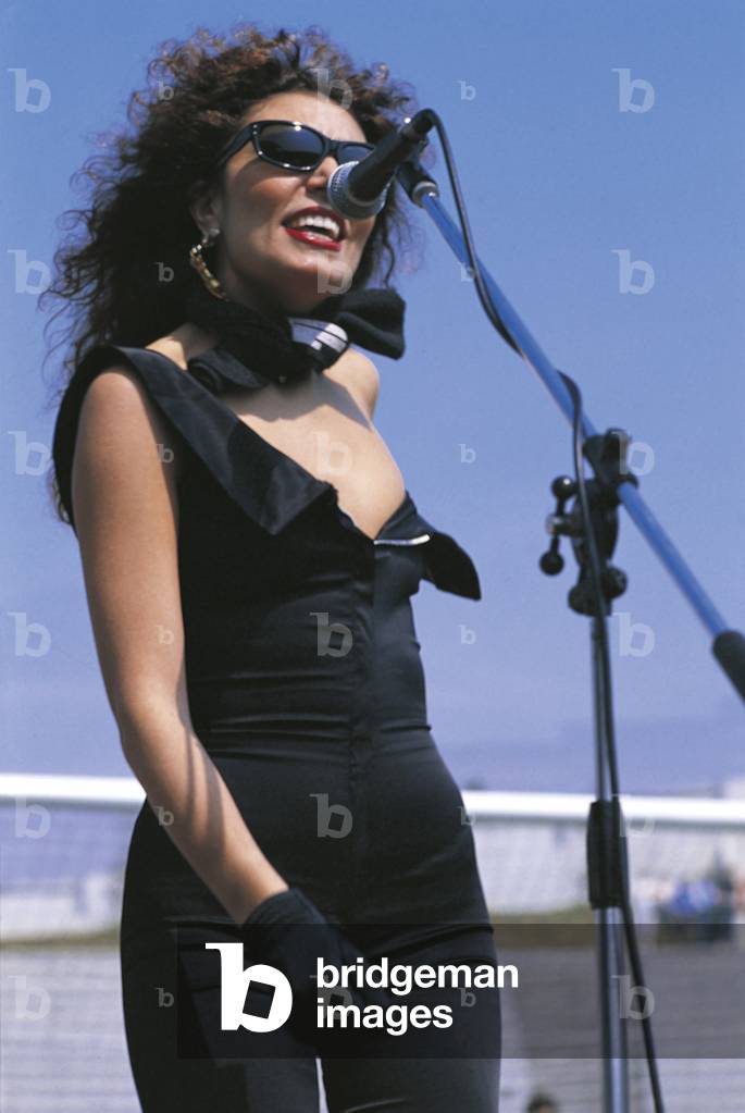 Loredana Berté singing in a jumpsuit
