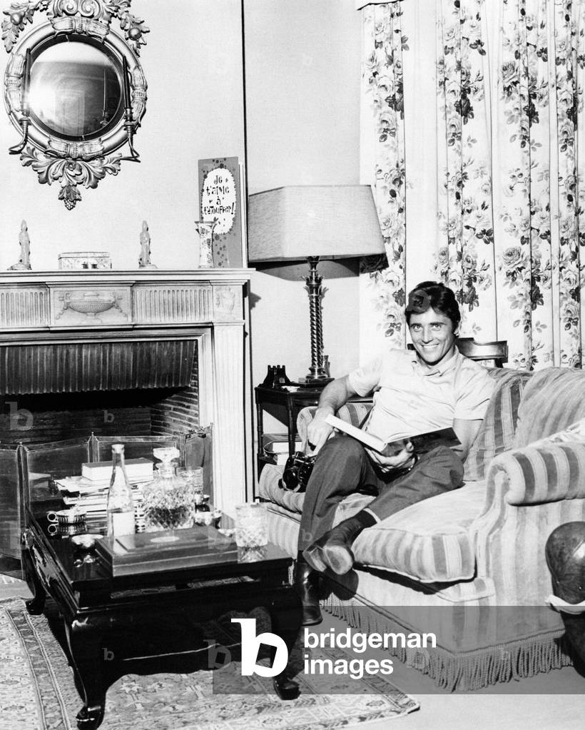 Sacha Distel reading a book, Paris, France