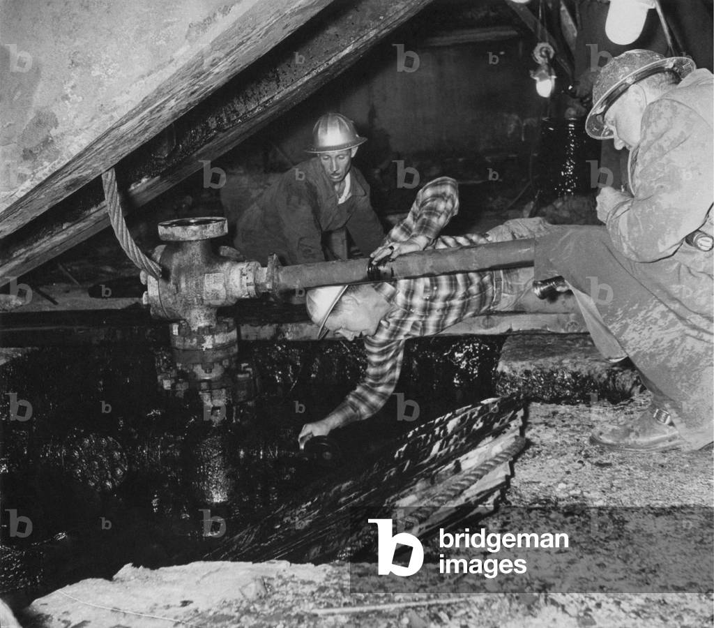 Myron Kinley repairs an oil well, Ragusa, Italy