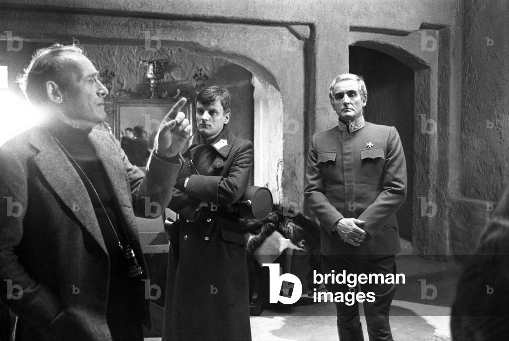 Jacques Perrin, Valerio Zurlini and Vittorio Gassman on the film set of The Desert of the Tartars (b/w photo)