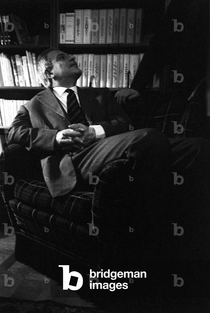 Elio Vittorini lying on an armchair