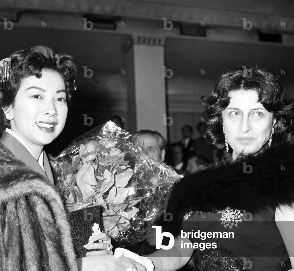 Anna Magnani and Miiko Taka shaking hands, Italy, 1958 (b/w photo)