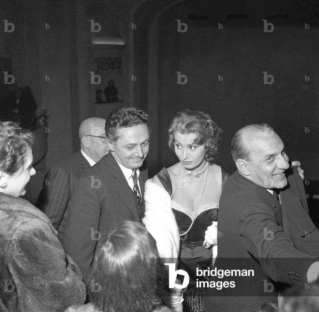 Dino Risi and Sophia Loren attending the premiere of the film Scandal in Sorrento, Italy, 1955 (b/w photo)