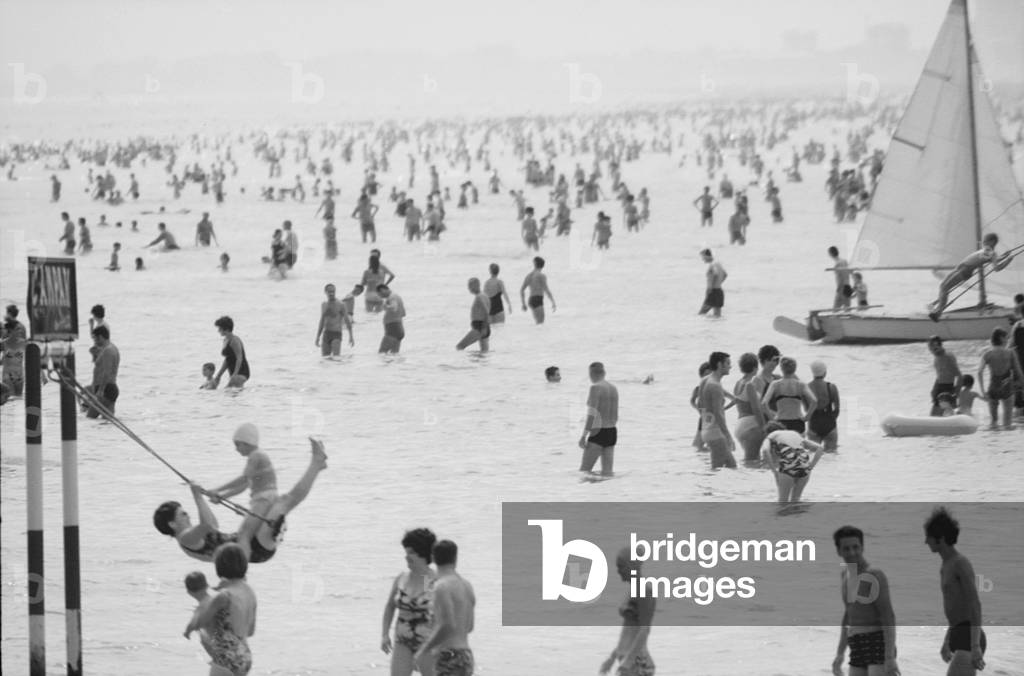 15th August 1969 - Crowds of bathers storming the beaches, Italy, 1969 (b/w photo)