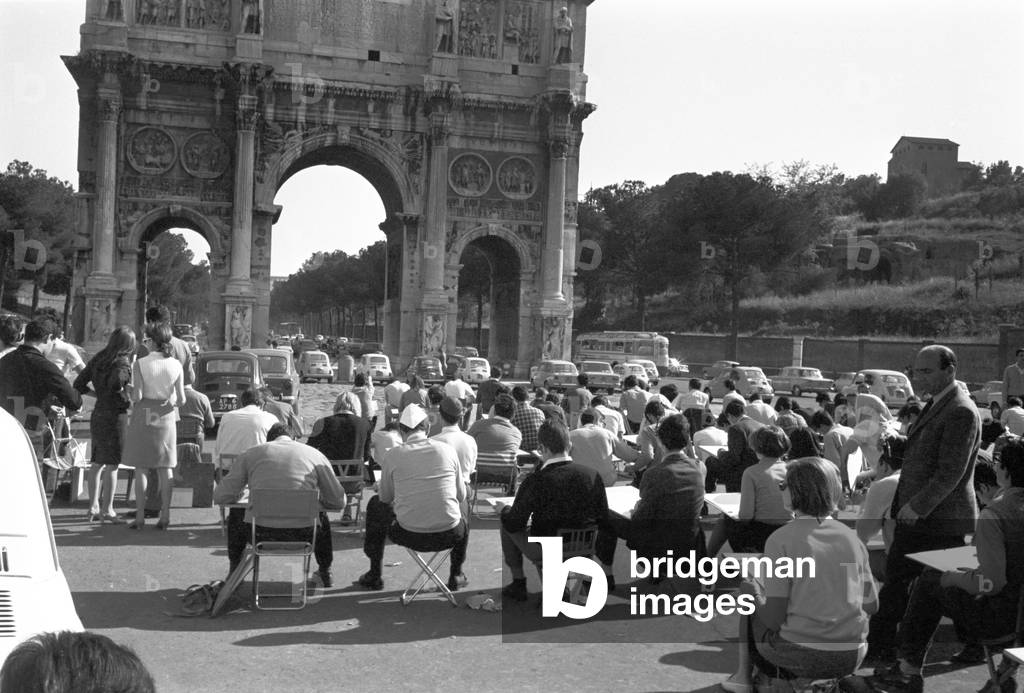 Art students in front of the Arch of Constantine, Rome, Italy, 1950 (b/w photo)