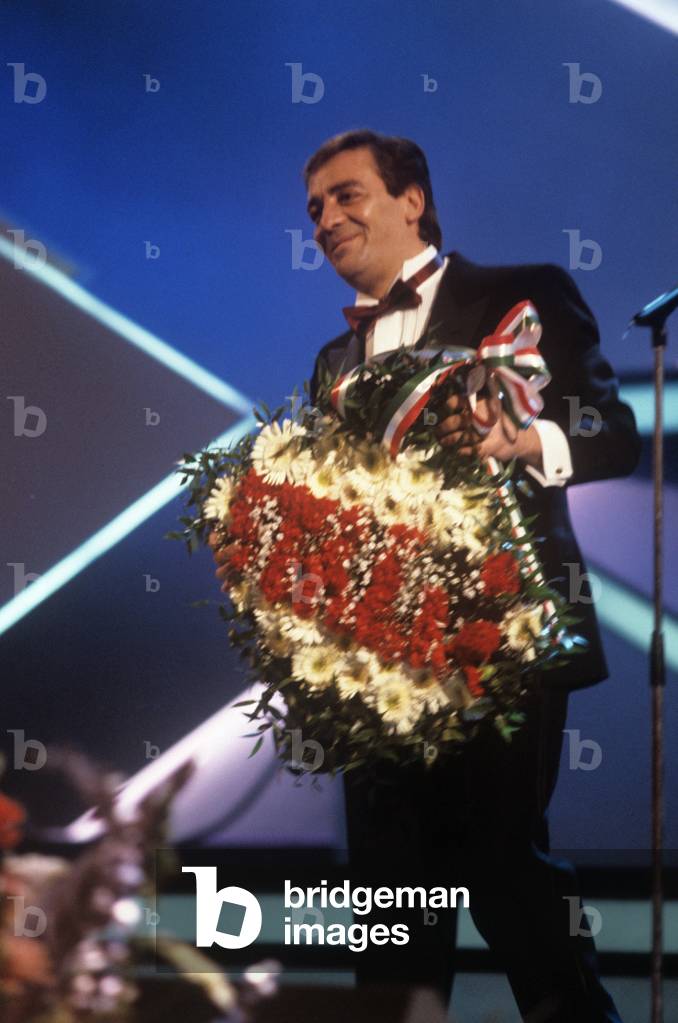 Mino Reitano holding a garland , Sanremo, Italy