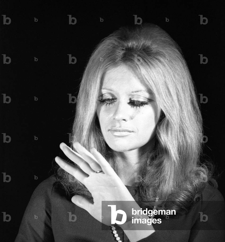 A woman looking at her wedding ring, Italy