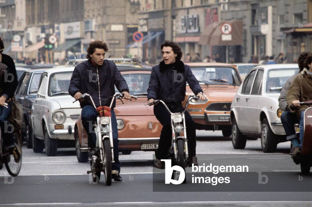 Two boys on a motor scooter, Milan, Italy