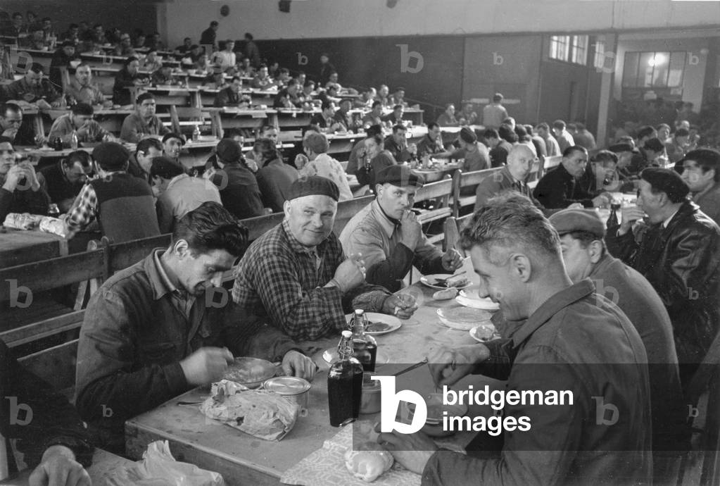 Workers eating in the Pirelli canteen, Italy, 1950 (b/w photo)